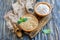 Wooden bowls with whole oats and oat flour.