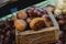 Wooden box with brown edible chestnuts on a street market in Seoul Korea