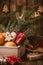 Wooden box with Christmas fruits and gifts, homemade xmas cookie