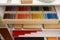 Wooden box with color tablets and other montessori toys on shelves