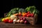 Wooden box full of different types of fresh vegetables on black background