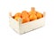 Wooden box of oranges isolated