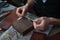 A wooden box for packing finished handmade leather products. The craftsman prepares a handmade box.