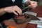 a wooden box for packing finished handmade leather products. The craftsman prepares a handmade box. Small business