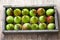 Wooden box with perfectly formed ripen pears. Old wooden background