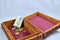 Wooden box with red carpet, coins and euro banknote