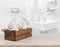 Wooden box with white spa towels on blurred bathroom background