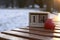 Wooden boxes calendar. 14th February - saint Valentines day. Heart close to the date calender on the bench outdoors with the snow