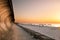 Wooden breakwater at sunset on the Baltic Sea