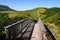 Wooden bridge access to the Puy de DÃ´me volcano mountain on Puy Pariou in Auvergne french