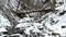 Wooden bridge across a mountain river in winter.