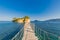 Wooden bridge from Agios Sostis leading to small rocky island. Bay of Laganas, Zakynthos island, Greece