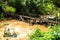 Wooden bridge crossing the Brook at Si Dit waterfall.