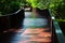 A wooden bridge for crossing a canal in a park