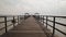 Wooden bridge dock or pier or boardwalk jetty for ship to dock at the shore