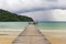 Wooden bridge extended into the sea.