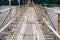 Wooden bridge footbridge walkway crossing river