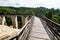 Wooden bridge held by massive rock pillars leads the way into the Neamt Citadel is a medieval fortress located in north-eastern