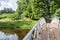 Wooden bridge and house of log green summer wild adventure forest