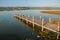 Wooden bridge on the lake. Beautiful landscape overlooking the lake in Coba. Mexico, Yucatan.