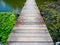 Wooden bridge in lotus pond