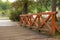 Wooden bridge with orange railing