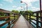 Wooden bridge over small lake.