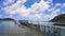 Wooden bridge pathway for group of people, tour, tourist walk to get in speedboat and longtail boat to take trip on sea go to isla