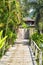 Wooden bridge to the entrance to the villa of resort.
