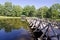 Wooden brigde on resort lake water