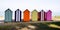 Wooden brightly coloured beach huts on West atlantic beach french in summertime