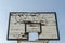 Wooden broken basketball board blue sky background