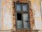Wooden , broken window on abandoned crumbling brick house i