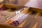 Wooden brown backgammon game with a dice