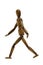 Wooden brown mannequin in walking pose, white background, isolate.