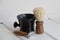 Wooden brown razor, wooden brown brush, black ceramic bowl