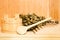 A wooden bucket, a birch broom and other accessories in a finnish classic sauna or russian bath. Free space on a wooden