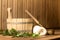 Wooden bucket, birch broom, towel and ladle in the steam room of the sauna