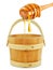 Wooden bucket with honey