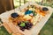 Wooden buffet table with snacks, appetizer and fruits