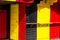 Wooden building with Belgium and Germany flag colors