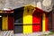 Wooden building with Belgium and Germany flag colors