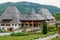 Wooden buildings in the courtyard of Barsana Monastery, Maramures, Romania