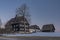 Wooden buildings in Jizerka small village before cold fresh color sunrise