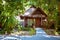 Wooden bungalow on the door of which hangs a sign