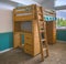 Wooden bunk bed in child`s bedroom