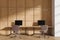 Wooden business coworking interior with pc monitors and chairs in row