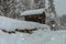 Wooden cabin in the austrian alps, covered with snow