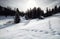 Wooden cabin in snowy alpine hills