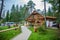 Wooden cabin with tourists at Hija Glamping Lake Bloke in Nova Vas, Slovenia